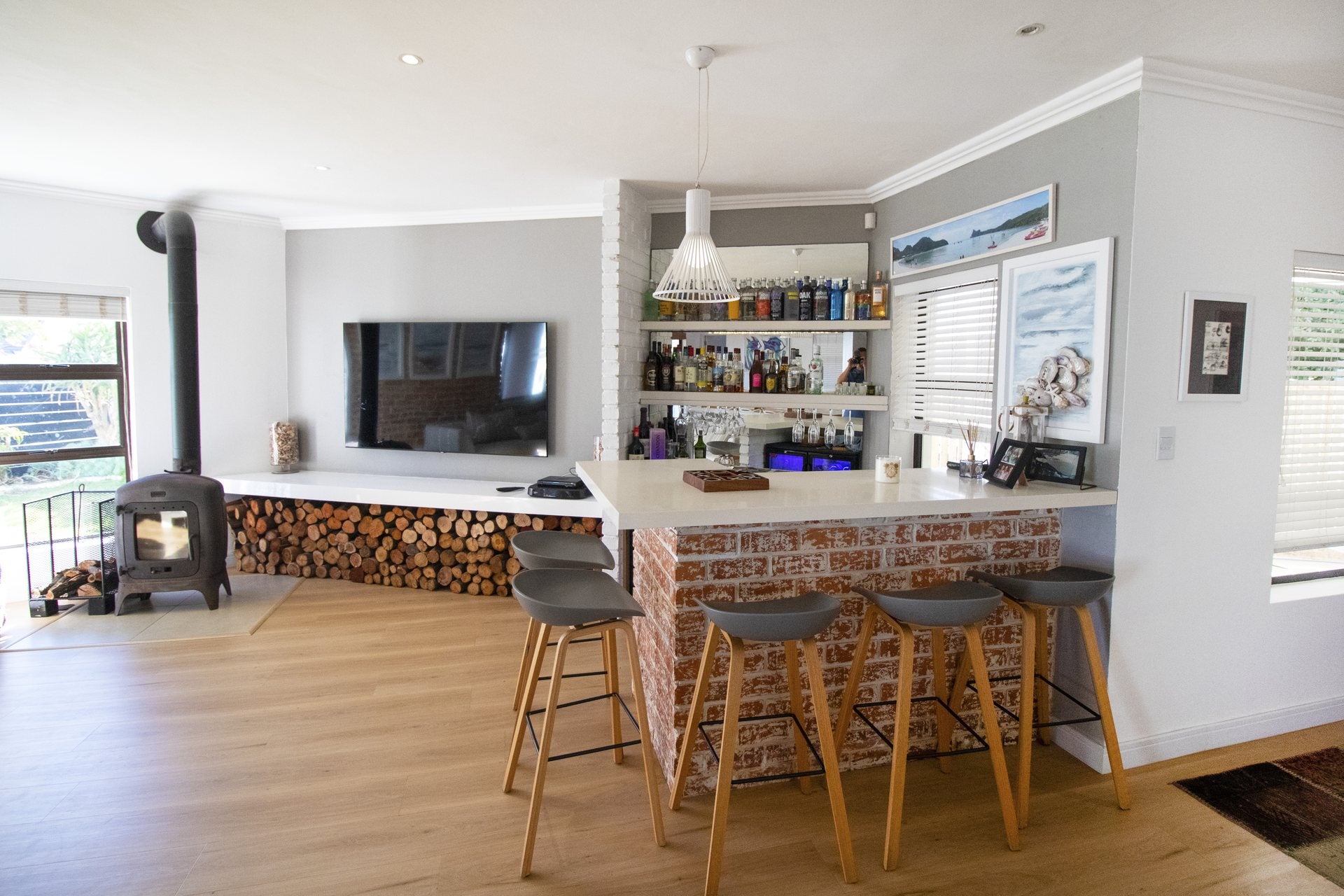 Open-plan home bar and living area photographed by Media Fans
