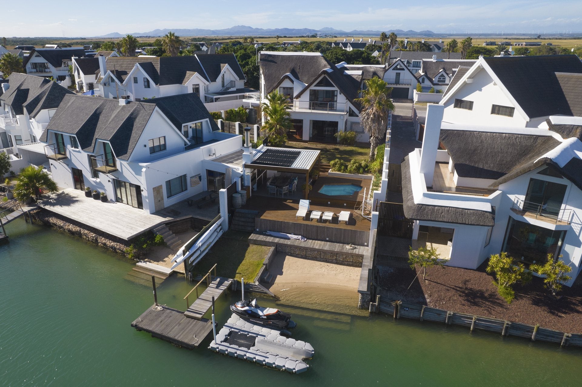 Drone view of a canal-side property photographed by Media Fans