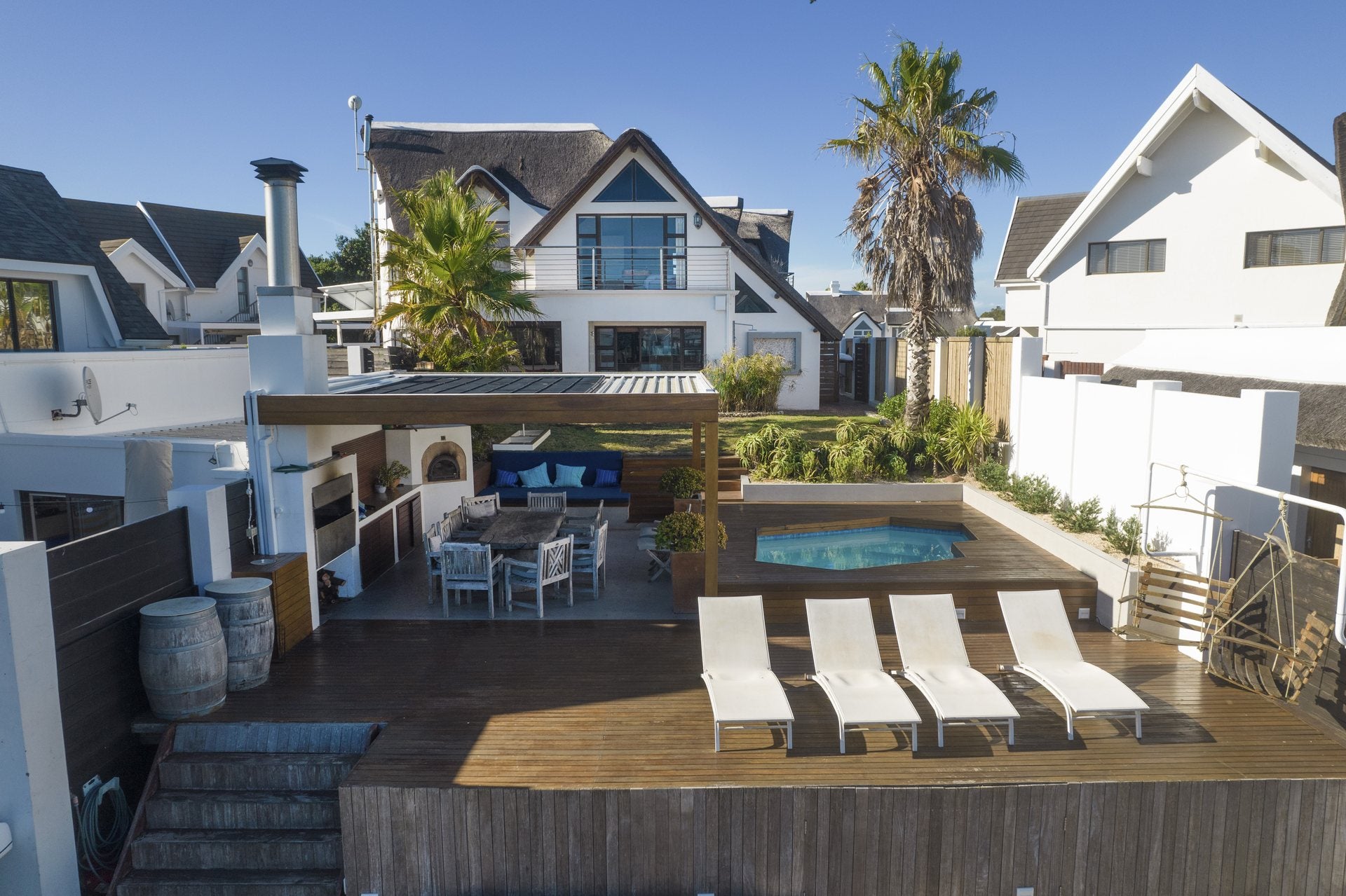 Canal-side entertainment deck and pool photographed by Media Fans