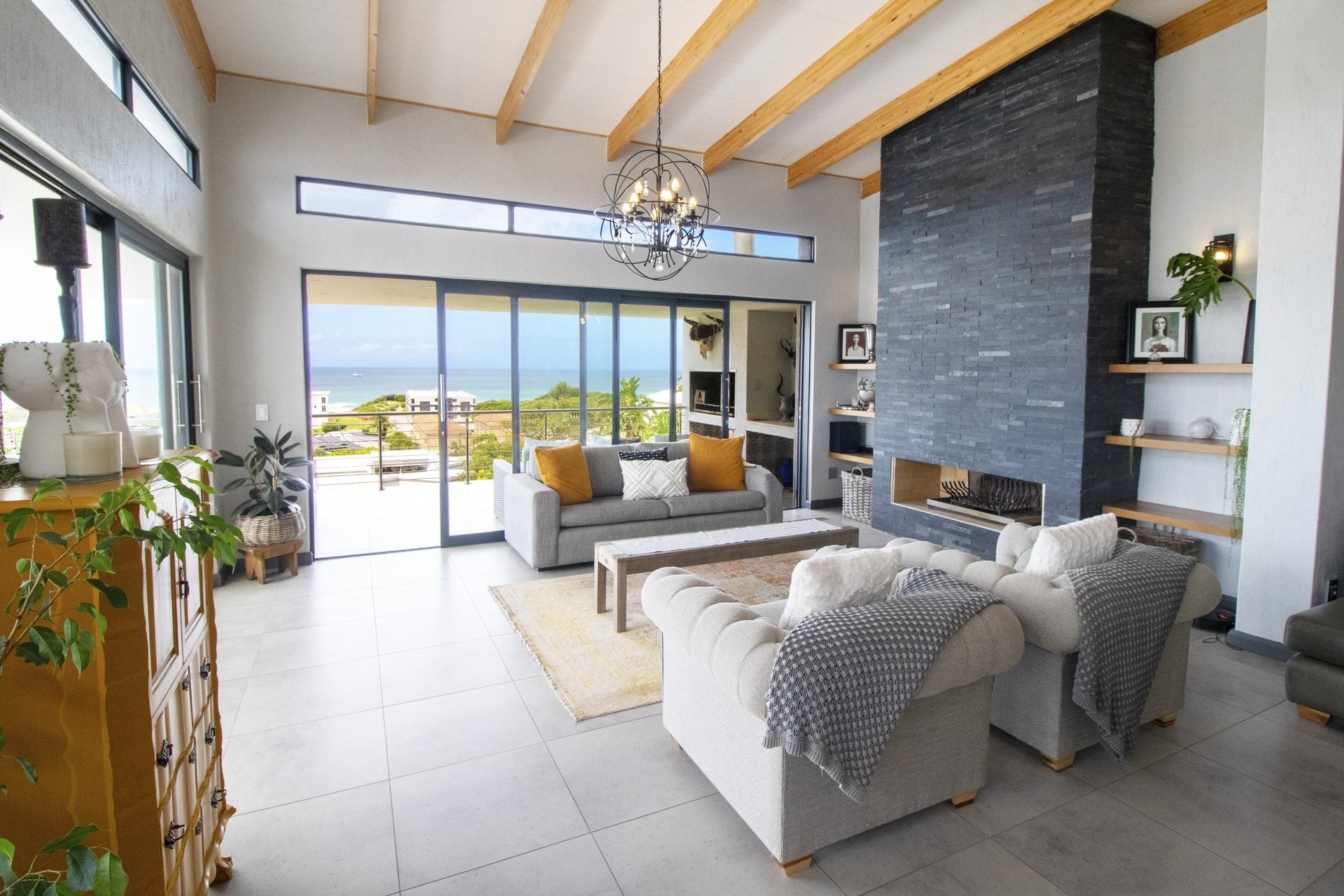 Modern double-volume lounge with an ocean view