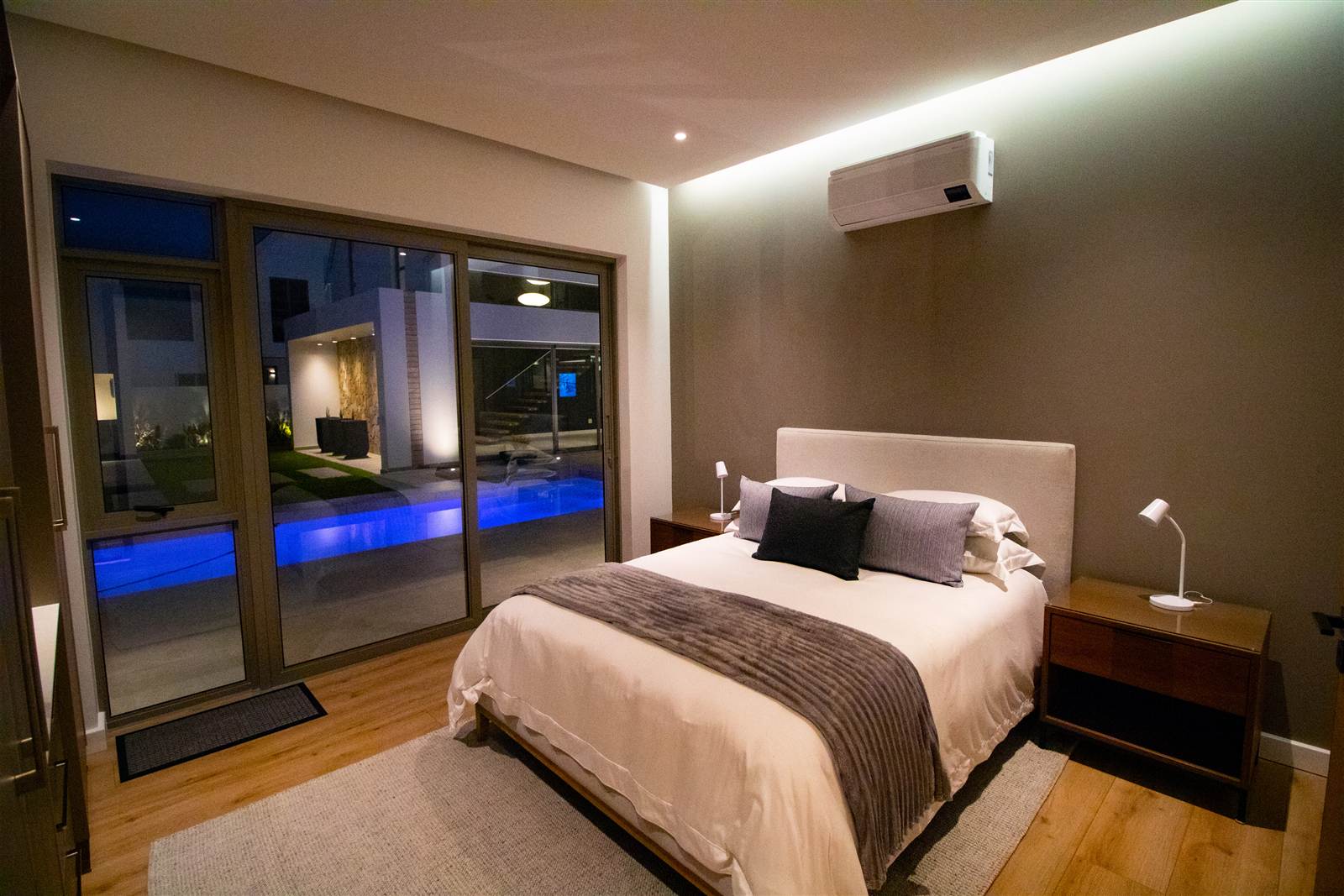 Evening bedroom interior with a pool view photographed by Media Fans