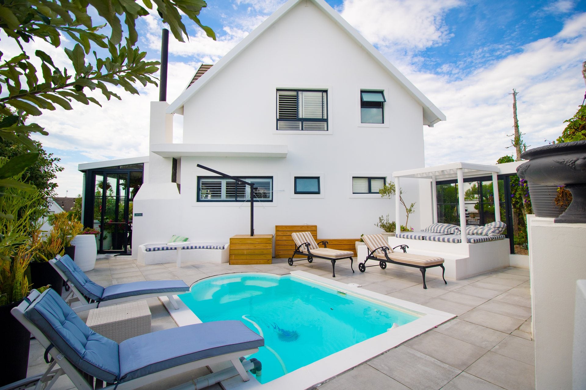 White coastal home and swimming pool photographed by Media Fans